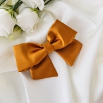 Mała kokarda do włosów Na spince Miodowa